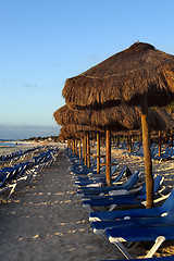 Image showing Sraw umbrella at sandy beach