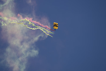 Image showing Flying parachutists on sky 