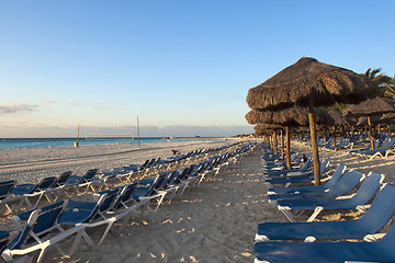 Image showing Sraw umbrella at sandy beach