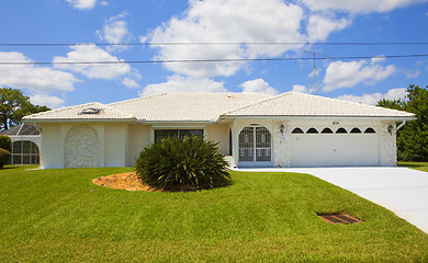 Image showing Luxury family house with landscaping on the front and blue sky o