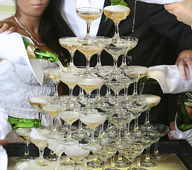 Image showing Pouring champagne into a glass on a wedding celebration