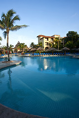 Image showing Beautiful pool and patio in tropical setting 