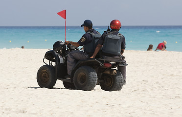 Image showing Coast police cheking the beach.