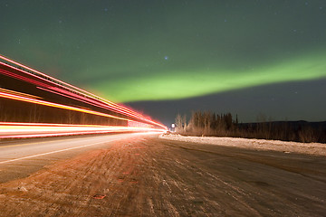 Image showing Truck lights and aurora borealis