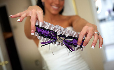 Image showing Bride dressing for the wedding ceremony 