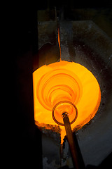 Image showing Glass furnace. Glass Blower at Work