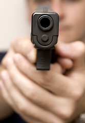 Image showing Man pointing a gun.