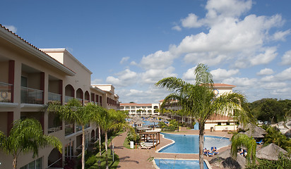 Image showing Beautiful pool and patio in tropical setting 