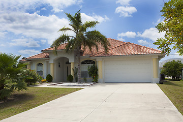 Image showing Luxury family house with landscaping on the front and blue sky o