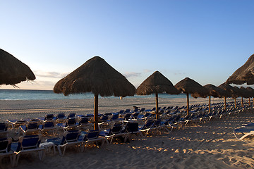 Image showing Sraw umbrella at sandy beach