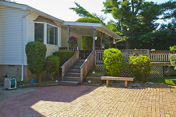 Image showing Luxury family house with landscaping on the front and blue sky o