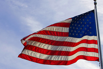 Image showing Stock Photo:
American flag against blue sky
