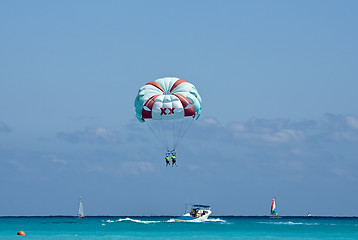 Image showing Couple flys on a parachute 