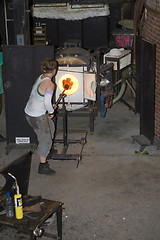 Image showing Glass furnace. Glass Blower at Work