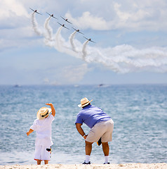 Image showing Father and son on an airshow 