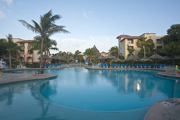 Image showing Beautiful pool and patio in tropical setting 