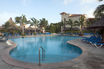 Image showing Beautiful pool and patio in tropical setting 