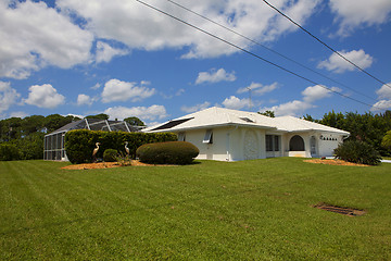 Image showing Luxury family house with landscaping on the front and blue sky o