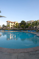 Image showing Beautiful pool and patio in tropical setting 