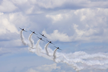 Image showing Several  planes performing in an air show