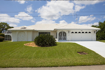 Image showing Luxury family house with landscaping on the front and blue sky o