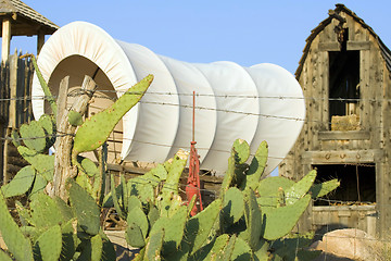 Image showing Western covered wagon on yard of Fort