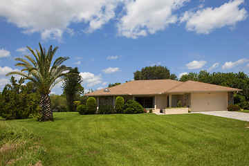 Image showing Luxury family house with landscaping on the front and blue sky o