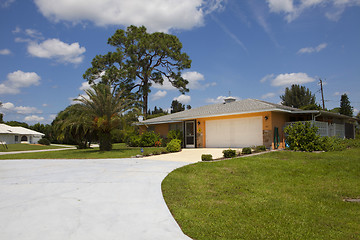 Image showing Luxury family house with landscaping on the front and blue sky o