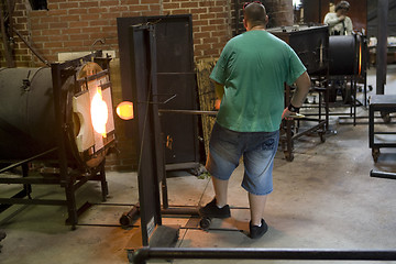 Image showing Glass furnace. Glass Blower at Work