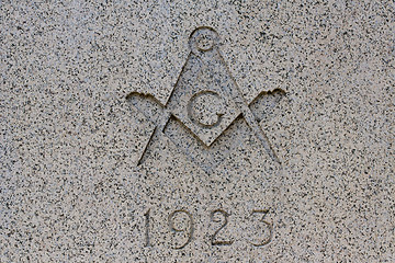 Image showing Traditional masonic symbol on marble wall 