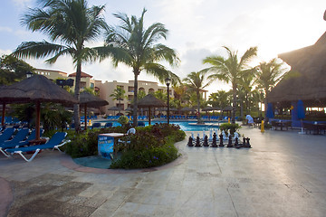 Image showing Beautiful pool and patio in tropical setting 