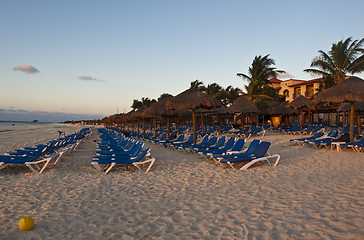 Image showing Sraw umbrella at sandy beach