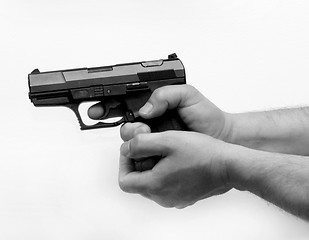 Image showing Pistol in hand