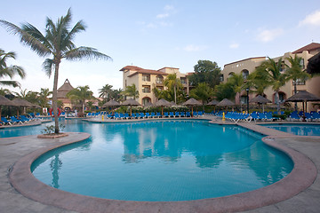 Image showing Beautiful pool and patio in tropical setting 