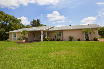 Image showing Luxury family house with landscaping on the front and blue sky o