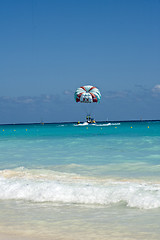 Image showing Couple flys on a parachute 