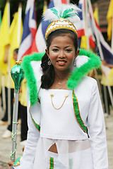 Image showing Beautiful young Thai marching band member participates in a para