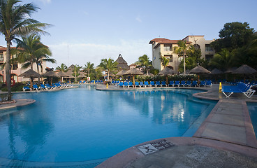 Image showing Beautiful pool and patio in tropical setting 