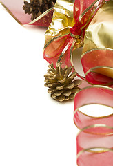 Image showing Christmas Present with Red Ribbon and Pine Cones on White