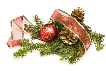 Image showing Christmas Ornaments, Pine Cones, Red Ribbon and Pine Branches on