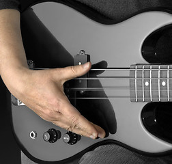 Image showing bass guitar and hand