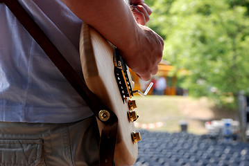 Image showing Guitarist plays during a soundcheck on stage