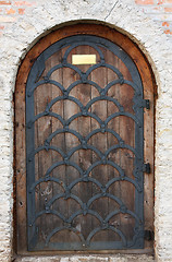 Image showing Old wooden door from medieval era.
