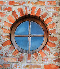 Image showing Round window on brick wall on castle