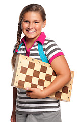 Image showing Schoolgirl with chessboard