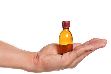 Image showing Hand with small bottle