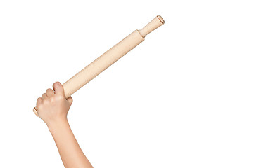 Image showing Hand with rolling pin