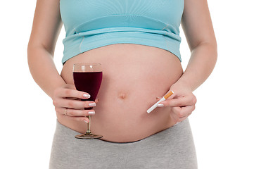 Image showing Pregnant belly with wine and cigarettes