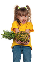 Image showing Little girl with pineapple