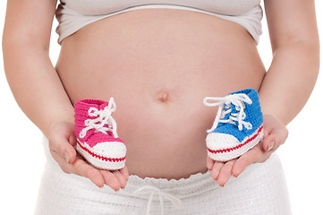Image showing Pregnant woman with baby's bootees